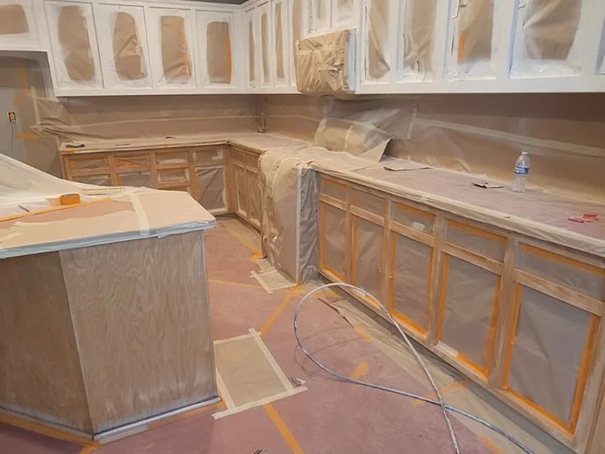 Kitchen cabinets masked and prepped for spraying